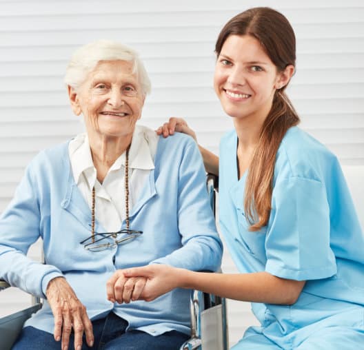 caregiver and senior smiling