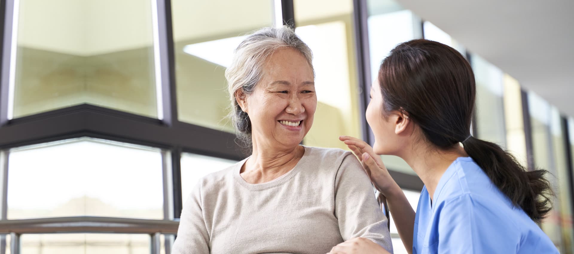 caregiver and senior smiling