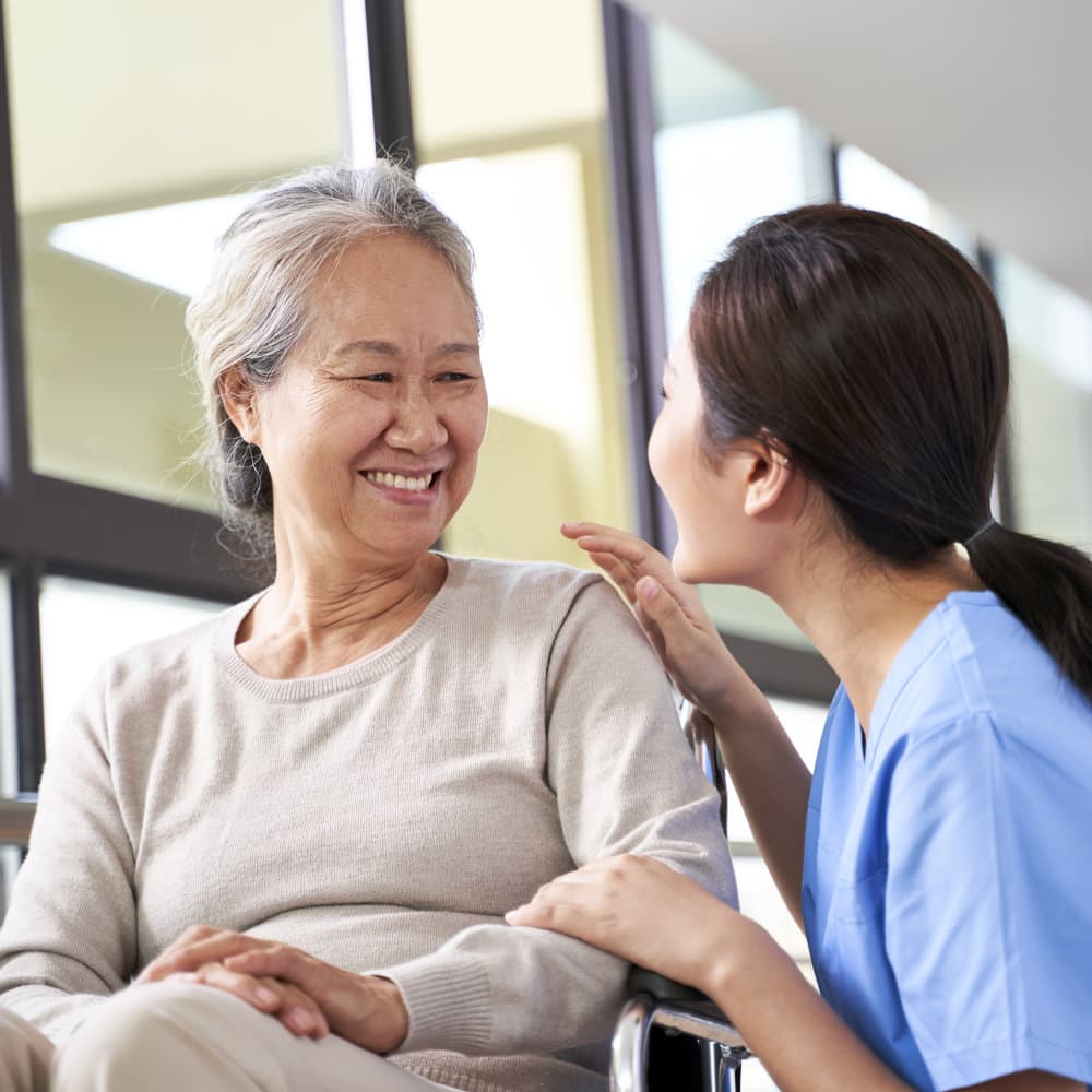 caregiver and senior smiling