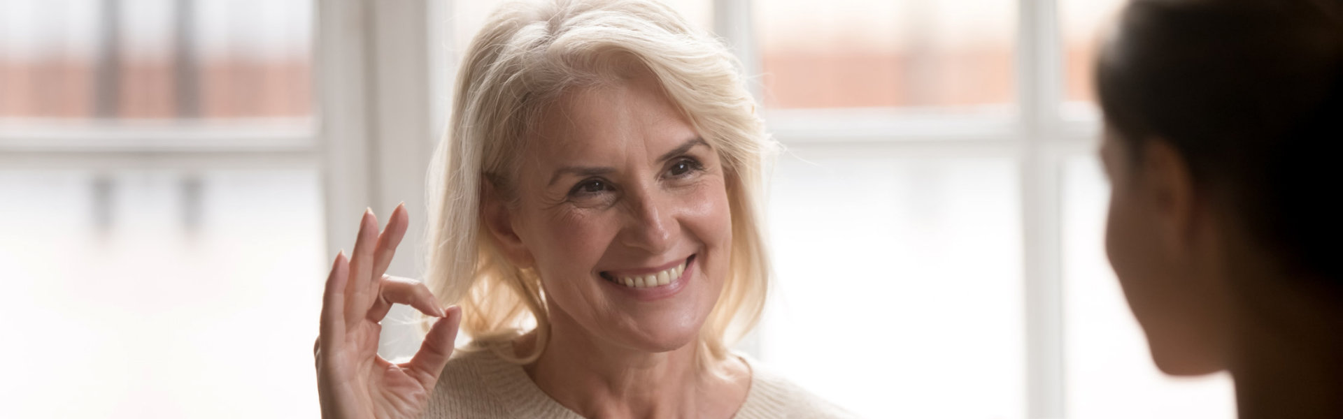 senior doing okay hand sign gesture