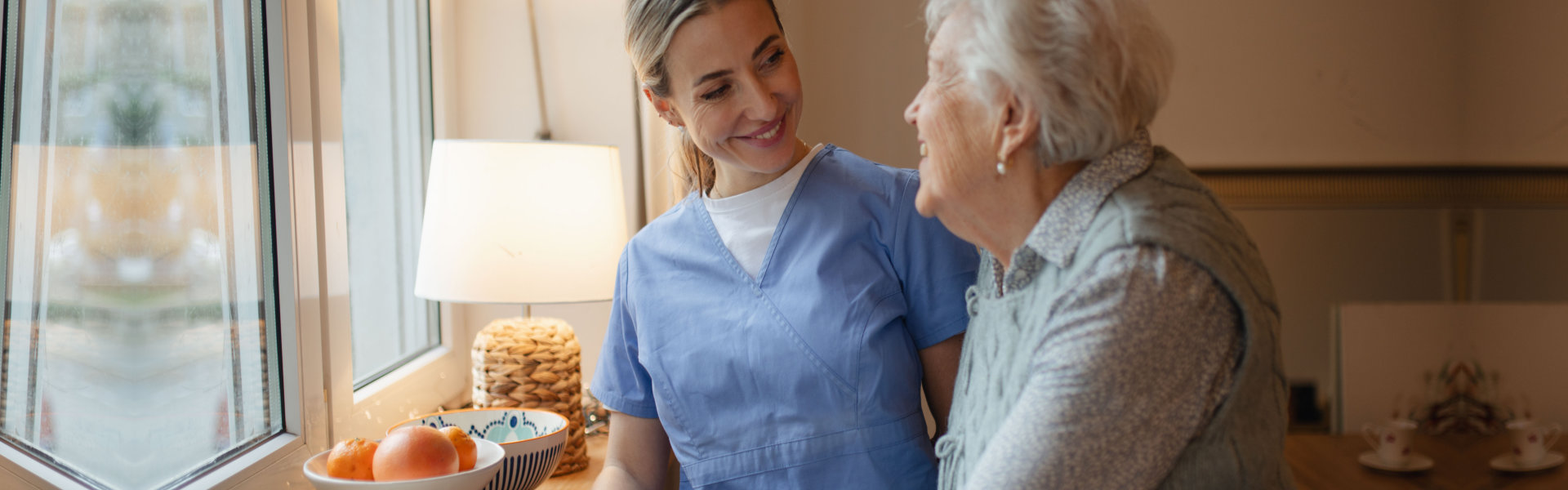 healthcare worker visiting a senior patient at home.