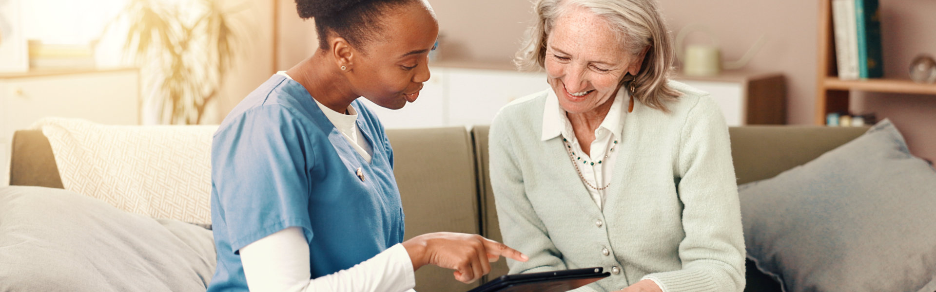 happy and nurse with senior woman on sofa for medical service, consulting and help.